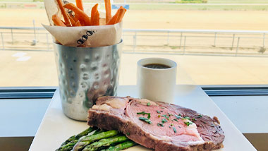 prime rib with asparagus and sweet potato fries