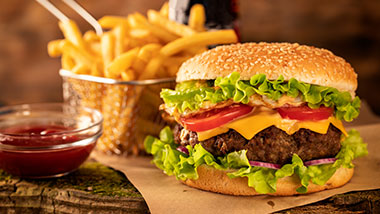 cheeseburger with fries and a side of ketchup
