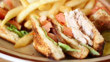 Club sandwich with french fries